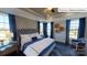 Main bedroom with high ceilings, plush carpeting, and en-suite bathroom at 2015 Canvasback Way, Indian Trail, NC 28079