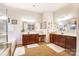 Elegant bathroom with double vanity and a soaking tub at 16515 Governors Club Ct, Charlotte, NC 28278