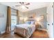 Cozy bedroom with a queen-size bed and beach decor at 16515 Governors Club Ct, Charlotte, NC 28278