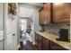 Well-equipped breakfast bar with granite countertop and built-in cabinetry at 16515 Governors Club Ct, Charlotte, NC 28278