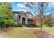 Two-story brick home with stone accents and landscaping at 16515 Governors Club Ct, Charlotte, NC 28278