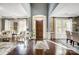 Inviting foyer with high ceilings, a wooden front door, and gleaming hardwood floors at 16515 Governors Club Ct, Charlotte, NC 28278