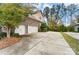 Three-car garage with large concrete driveway at 16515 Governors Club Ct, Charlotte, NC 28278