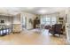 This loft features neutral walls, carpet, a sitting area, and plenty of natural light from the windows at 16515 Governors Club Ct, Charlotte, NC 28278