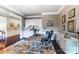 Office space includes hardwood floors, white cabinets, and decorative artwork at 16515 Governors Club Ct, Charlotte, NC 28278