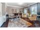 Office space featuring hardwood floors, natural light, and decorative artwork at 16515 Governors Club Ct, Charlotte, NC 28278
