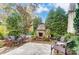 Charming patio with stone fireplace and comfortable seating at 16515 Governors Club Ct, Charlotte, NC 28278