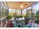 Relaxing screened porch with table and chairs overlooking the pool at 16515 Governors Club Ct, Charlotte, NC 28278