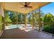 Relaxing screened porch overlooking the pool and forest at 16515 Governors Club Ct, Charlotte, NC 28278
