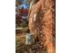 Brick exterior view featuring an air conditioning unit, surrounded by foliage, highlighting functional and natural aspects at 116 Lodge Hall Ct, Stony Point, NC 28678