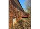 Brick exterior showing the back of the home, including a small deck area and walkout door at 116 Lodge Hall Ct, Stony Point, NC 28678