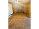 Cozy living room with brick fireplace and wood paneling, creating a warm atmosphere at 116 Lodge Hall Ct, Stony Point, NC 28678