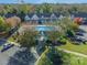 Aerial view of a pool area with green trees in front of a collection of townhomes at 1305 Penny Oaks Cv, Rock Hill, SC 29732