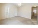 Spacious bedroom with neutral carpet, ceiling fan, and access to an en-suite bathroom at 1305 Penny Oaks Cv, Rock Hill, SC 29732