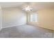 Spacious bedroom features vaulted ceilings, neutral carpet, and a bright window at 1305 Penny Oaks Cv, Rock Hill, SC 29732