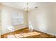 Bright dining area featuring wood floors, a window, and an elegant chandelier at 1305 Penny Oaks Cv, Rock Hill, SC 29732