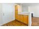 The kitchen area offers ample cabinet space and hardwood floors, seamlessly connecting to the living area at 1305 Penny Oaks Cv, Rock Hill, SC 29732