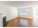 Cozy living room with fireplace, neutral paint, and ample natural light at 1305 Penny Oaks Cv, Rock Hill, SC 29732