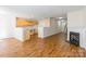 Bright living room with hardwood floors seamlessly connecting to the kitchen area at 1305 Penny Oaks Cv, Rock Hill, SC 29732