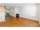 Open-concept living room with hardwood floors, fireplace, and easy access to the kitchen at 1305 Penny Oaks Cv, Rock Hill, SC 29732