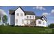 A spacious backyard featuring a covered patio, perfect for enjoying outdoor living at 229A Ballard Ct, Fort Mill, SC 29715