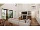 Bright living room with a fireplace, high ceilings, and large windows for natural light at 229A Ballard Ct, Fort Mill, SC 29715