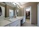 Bright bathroom featuring a vanity with ample counter space and a walk-in closet at 3513 Country Club Dr, Gastonia, NC 28056