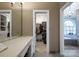 Bathroom featuring vanity, walk-in closet and bathtub at 3513 Country Club Dr, Gastonia, NC 28056