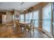 Bright dining room featuring a wooden table, large windows, and decorative wall accents at 3513 Country Club Dr, Gastonia, NC 28056