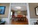 Classic dining room with hardwood floors, wainscoting, and an elegant chandelier at 3513 Country Club Dr, Gastonia, NC 28056