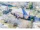 Beautiful two-story brick home featuring an expansive driveway and lush, mature landscaping at 3513 Country Club Dr, Gastonia, NC 28056