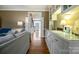 Hallway featuring hardwood floors and a view of the staircase and front door at 3513 Country Club Dr, Gastonia, NC 28056