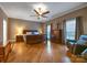 Relaxing main bedroom with hardwood floors, ceiling fan and plenty of natural light at 3513 Country Club Dr, Gastonia, NC 28056