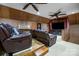 Attic movie room with leather recliners, wood paneling, and a large flat-screen TV at 3513 Country Club Dr, Gastonia, NC 28056