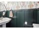 Charming powder room with elegant fixtures, vessel sink, and stylish floral wallpaper at 5300 Fair Wind Ln, Charlotte, NC 28212