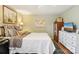 Bedroom with neutral colored walls, wood floors, ceiling fan, and a closet/cabinet at 5300 Fair Wind Ln, Charlotte, NC 28212