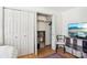Bedroom closet with double doors, shelving, and convenient storage options at 5300 Fair Wind Ln, Charlotte, NC 28212