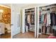 Walk-in closet with custom shelving, drawers, and storage for shoes, bags, and clothing at 5300 Fair Wind Ln, Charlotte, NC 28212
