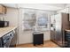Bright laundry/kitchen area with stainless steel refrigerator and lots of natural light at 5300 Fair Wind Ln, Charlotte, NC 28212