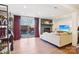 Bright living room with fireplace, sliding glass door leading to the backyard, and modern furnishings at 5300 Fair Wind Ln, Charlotte, NC 28212