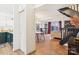 Open-concept living space with dining area, staircase, and view into the comfortable living room at 5300 Fair Wind Ln, Charlotte, NC 28212