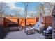 Cozy outdoor patio with a wood fence, outdoor seating, and greenery at 5300 Fair Wind Ln, Charlotte, NC 28212