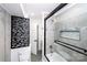 A stylish bathroom features a sleek glass shower, decorative partition, and modern fixtures at 6534 Providence Rd, Charlotte, NC 28226