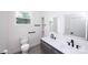 This bathroom features a dual sink vanity with modern fixtures, and a toilet at 6534 Providence Rd, Charlotte, NC 28226