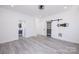 Spacious bedroom with large closets, modern lighting, and beautiful gray flooring at 6534 Providence Rd, Charlotte, NC 28226