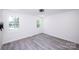 An additional view of the bedroom showcases great views from multiple windows at 6534 Providence Rd, Charlotte, NC 28226