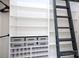 This closet features a unique ladder and plenty of custom storage at 6534 Providence Rd, Charlotte, NC 28226