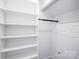 Bright closet with white shelving and a clothes rod for optimal storage solutions at 6534 Providence Rd, Charlotte, NC 28226