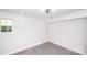 Bright room with concrete floor, modern ceiling fan, and a window for natural light at 6534 Providence Rd, Charlotte, NC 28226