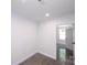 Clean, unfinished room showcasing a modern aesthetic with bright white walls and a concrete floor at 6534 Providence Rd, Charlotte, NC 28226